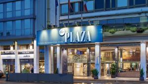 un bâtiment avec un panneau indiquant un magasin de pixka dans l'établissement Hotel Plaza, à Mestre