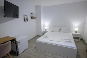 Postel nebo postele na pokoji v ubytování Vila RD