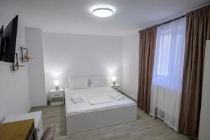 Postel nebo postele na pokoji v ubytování Vila RD