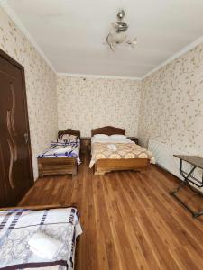 A bed or beds in a room at MOON NIGHT
