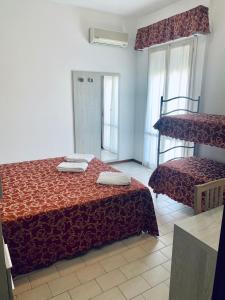 Postel nebo postele na pokoji v ubytování Hotel Belmar