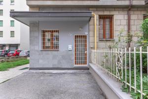 a house with a gate and a fence at Borgo Panigale Viola Apartment in Bologna