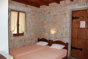 Letto o letti in una camera di Lalloudes Seaside Accommodation