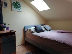 a bedroom with a bed with pillows on it at Apartment Felix in Split