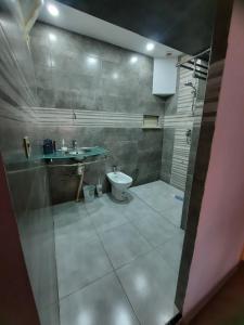 a bathroom with a sink and a toilet at Ninasaidia in Saïdia +29 photos