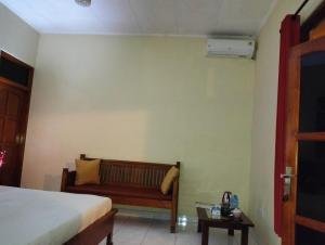 Postel nebo postele na pokoji v ubytování Kaia Lovina Guest House
