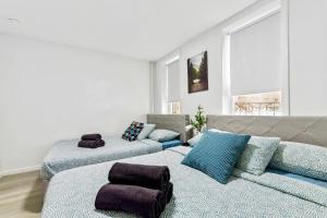 a living room with two beds and a couch at Gorgeous Manhatten Gem in New York