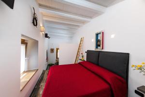 Katil atau katil-katil dalam bilik di La Quercia e l'Asino
