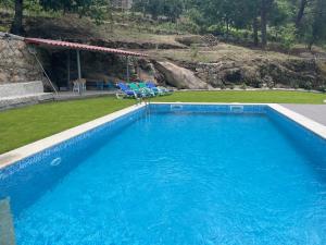 A piscina em ou perto de Quintinha de Pinouco