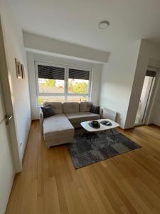 a living room with a couch and a table at Apartmani Kastel in Banja Luka