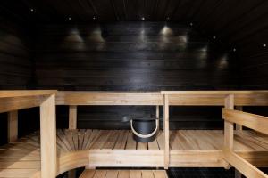 a small sauna with a trash can in it at Solo Sokos Hotel Helsinki in Helsinki +30 photos