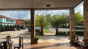 a patio with a view of a parking lot at Tuscany Hotel by skypark 