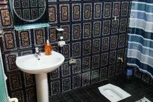 Koupelna v ubytování KASMI home + 23 fotografií