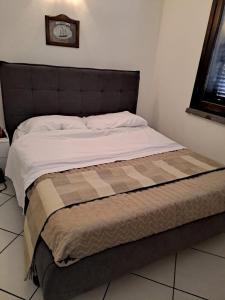 Posteľ alebo postele v izbe v ubytovaní Appartamenti Residence il Porto 13 e 16