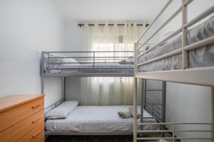 a bunk bed room with two bunk beds at Geranio in Caserío Bacarot