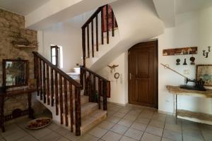a hallway with a staircase in a house at Olive Stone Villa 
