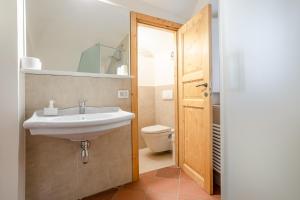 a bathroom with a sink and a toilet at Residenza de Gemmis in Altamura +46 photos