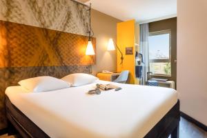 Postel nebo postele na pokoji v ubytování ibis Leuven Centrum