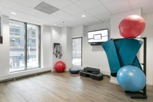 a room with red and blue balloons and a tv at Streeterville Studio w Deck Pool nr Beach CHI-583 in Chicago