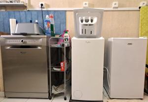 a kitchen with two refrigerators and a stove at La Maison du Verger in Sainte-Foy