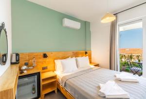 Postel nebo postele na pokoji v ubytování Mavilim Hotel