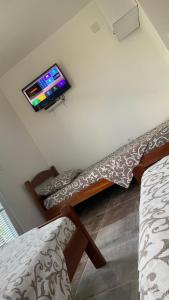 a living room with a tv on the wall at LamijaApartmani in Sutomore +20 photos