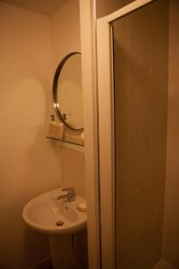 a bathroom with a sink and a mirror at Urban Chic Suite - Simple2let Serviced Apartments in Halifax