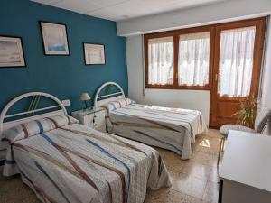 Ένα ή περισσότερα κρεβάτια σε δωμάτιο στο Casa Liberta