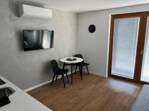 Una televisión o centro de entretenimiento en Pension Mikulov