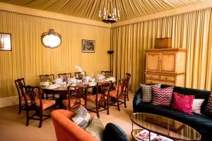 a dining room with a table and chairs at The Victorian Wing in Shifnal