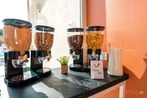 a counter with four different types of food at Spinola Stays in St. Julianʼs