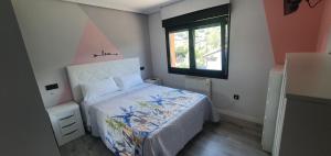 Katil atau katil-katil dalam bilik di Coqueto apartamento al lado de Cangas de Onis