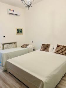 Cama ou camas em um quarto em Appartamento Bilocale Moderno Marina Centro Rimini