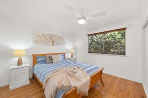 a bedroom with a bed and a window at Gretel Cl 4 Nelson Bay in Nelson Bay