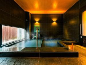 a swimming pool in a room with a pool at Super Hotel Tokyo Kinshicho Ekimae / Vacation STAY 78884 in Tokyo