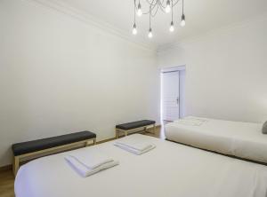 Posteľ alebo postele v izbe v ubytovaní SibsBcn-Paseo de Gracia Luxury Exclusive Gaudí