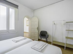 Posteľ alebo postele v izbe v ubytovaní SibsBcn-Paseo de Gracia Luxury Exclusive Gaudí