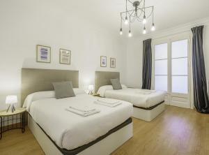 Posteľ alebo postele v izbe v ubytovaní SibsBcn-Paseo de Gracia Luxury Exclusive Gaudí