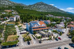 an aerial view of a town with a mountain at Hotel Vicko in Starigrad