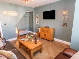 a living room with a couch and a table at 15 Market Place in Barnard Castle