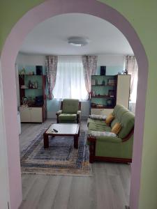 a living room with a couch and a table at Apartman Nikola in Rakovac