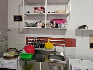 a small kitchen with a sink and a counter at Piccoledonne in Villaggio Mosè