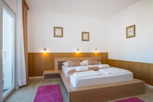 Posteľ alebo postele v izbe v ubytovaní Hotel Vicko