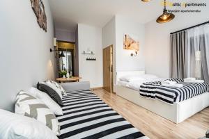 Postel nebo postele na pokoji v ubytování Baltic Apartments - Willa Carmen