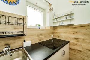 Kuchyň nebo kuchyňský kout v ubytování Baltic Apartments - Willa Carmen