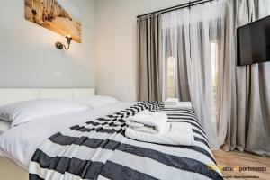 Postel nebo postele na pokoji v ubytování Baltic Apartments - Willa Carmen