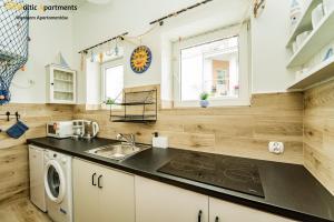 Kuchyň nebo kuchyňský kout v ubytování Baltic Apartments - Willa Carmen