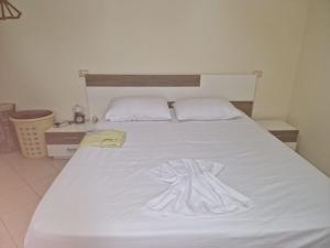 En eller flere senge i et værelse på Seaside Apartment 15