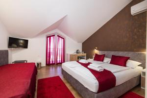 Posteľ alebo postele v izbe v ubytovaní Hotel Vicko