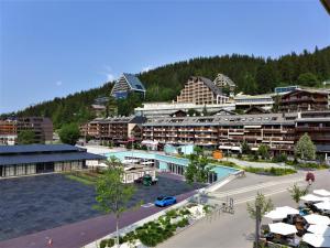 an aerial view of a resort with a parking lot at Apartment Farinet B 21 by Interhome in Crans-Montana